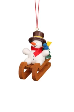 Christian Ulbricht Christbaumschmuck*Christbaumschmuck Schneemann auf Schlitten, bunt von